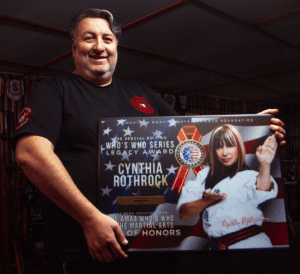 Wing Chun Sifu Maurice Novoa holding the AMAA Legends Award and Hall of Honors Plaque